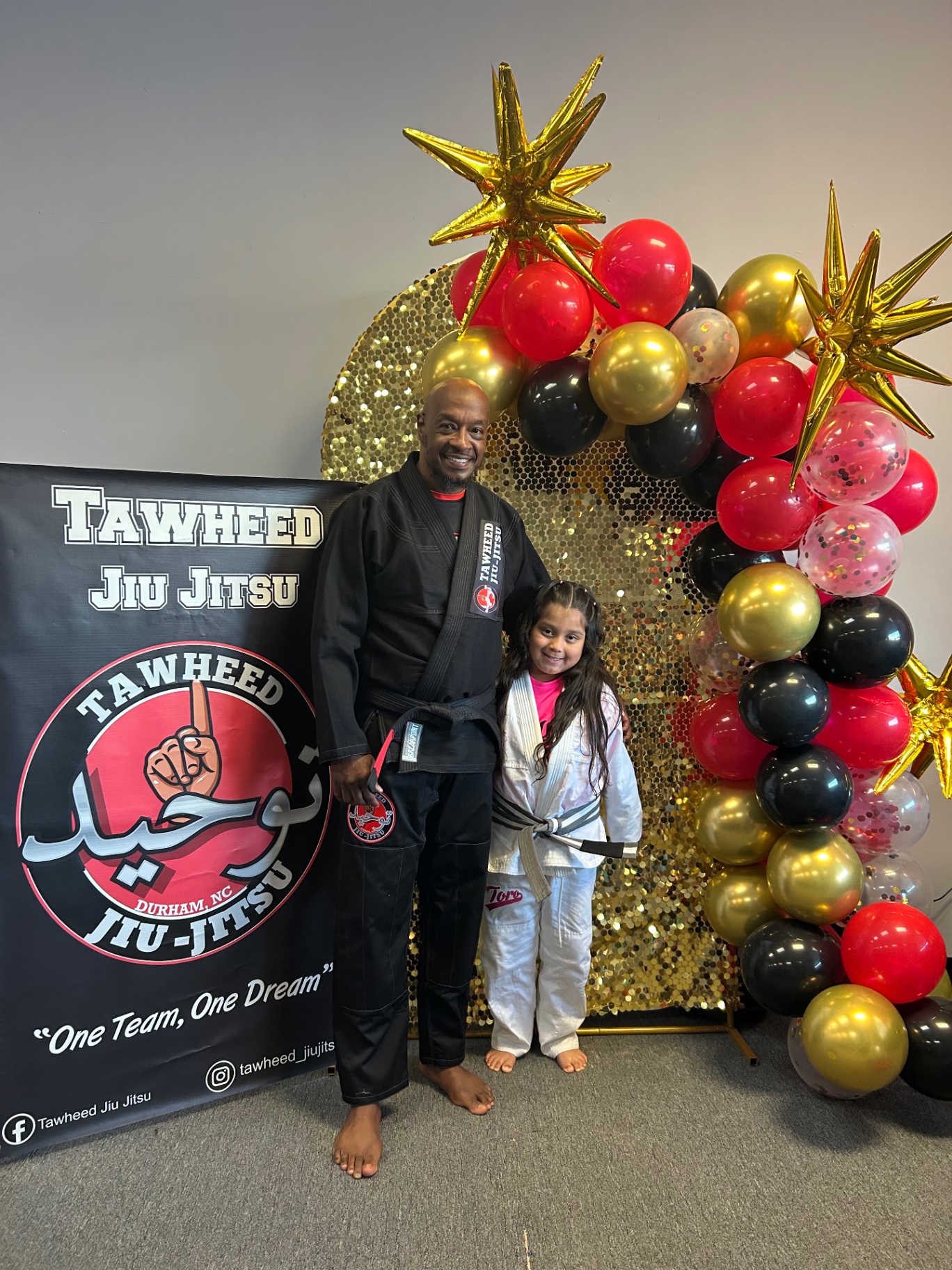 Coach with young student in gi