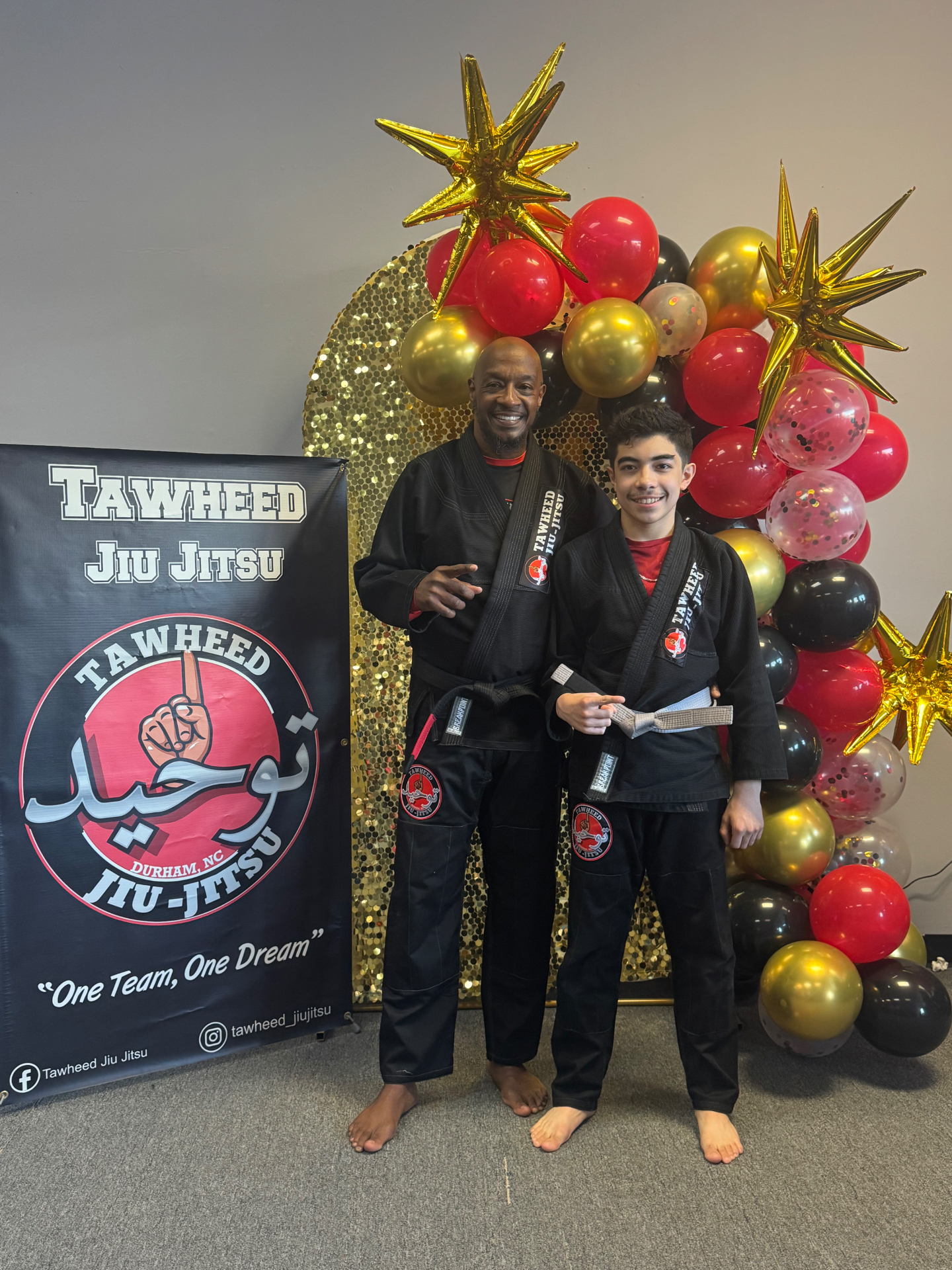 Coach with new white belt student