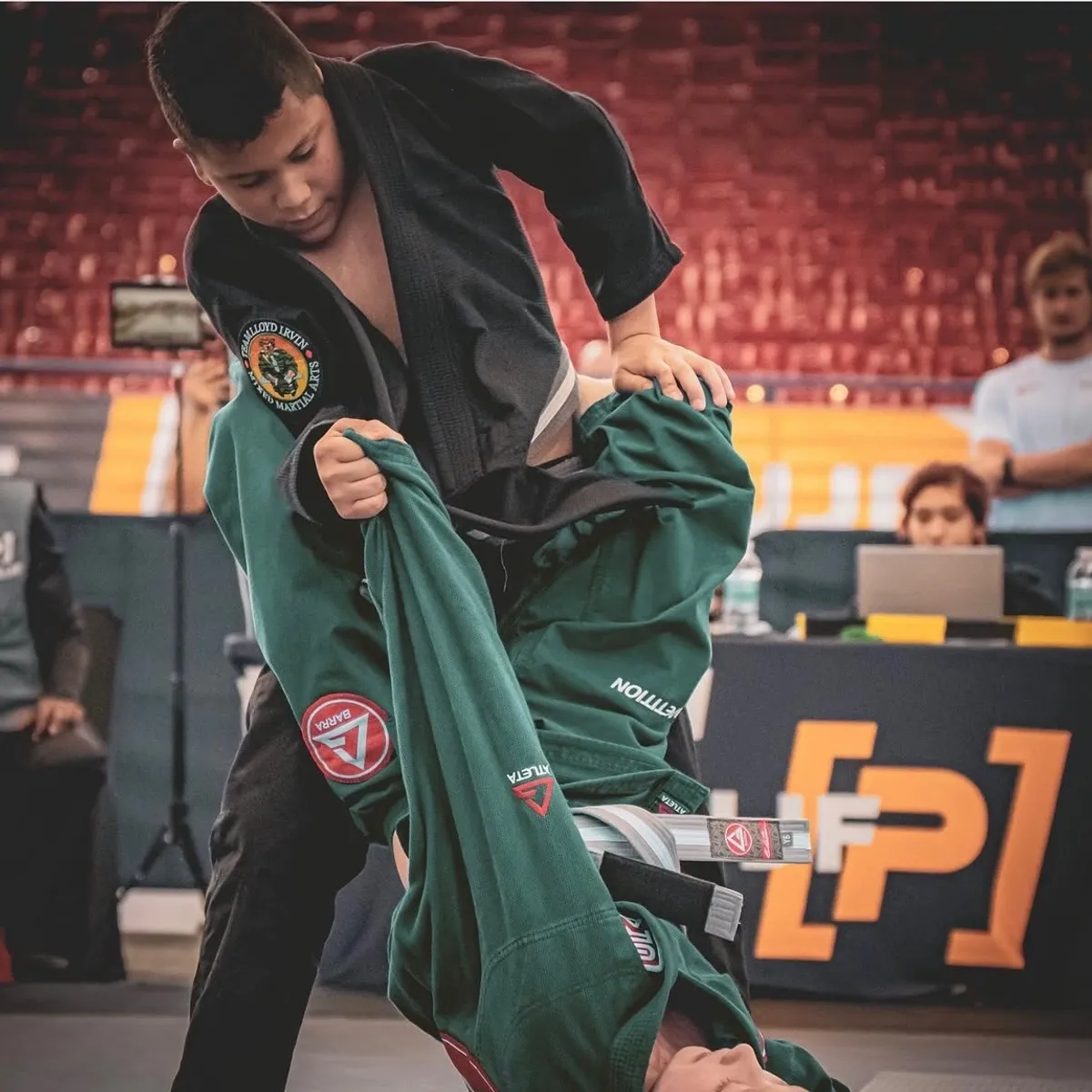 Competitor executing a takedown